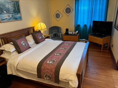 TV a/nebo společenská místnost v ubytování Rodmay Hotel
