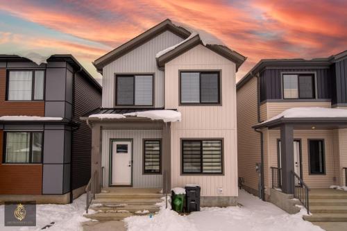 a painting of a house in the snow at FreshModernWEMGarageKingBed in Edmonton