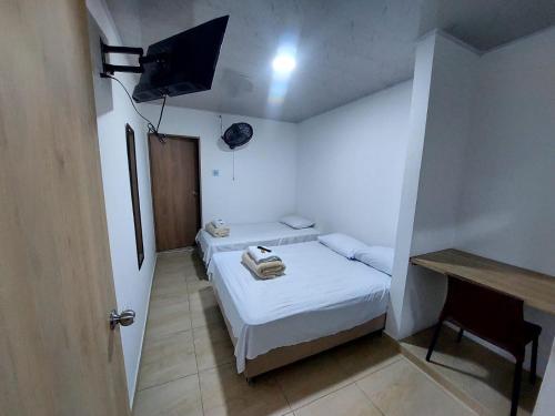 Postel nebo postele na pokoji v ubytování Iku Hotel