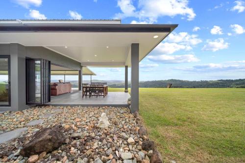 a house with a view of a field at Panorama Farm - 3BD Wilderness Retreat in Bald Knob