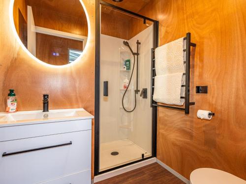 a bathroom with a shower and a sink at Mountain Haus - Ohakune Holiday Home in Ohakune