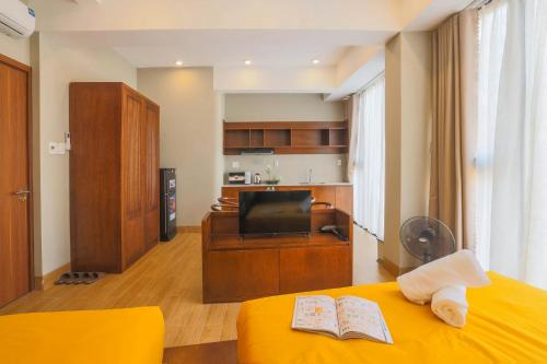 TV a/nebo společenská místnost v ubytování Vừng Hotel