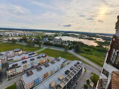 an aerial view of a city with buildings and a river at JJ's Modern Suite Kampar- Near UTAR in Kampar
