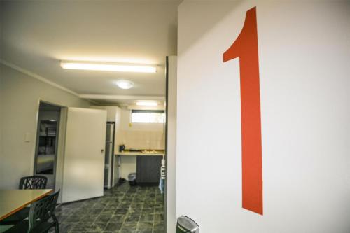 an arrow on the wall of an office with an arrow on the wall at Nightcap at Jamison Hotel in Penrith