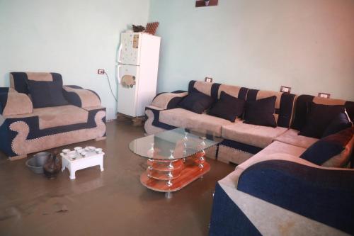 a living room with two couches and a table at Amazing Lalibela Home stay in Lalībela