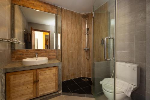 a bathroom with a toilet and a sink and a shower at SIEM REAP RIVER VIEW Residence in Siem Reap