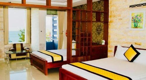 Katil atau katil-katil dalam bilik di Whale Ocean View Hotel