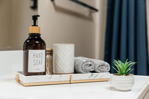 a bottle of wine and towels on a bathroom counter at Stunning 2 bedroom near by The Grove in Los Angeles