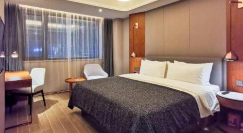 Ένα ή περισσότερα κρεβάτια σε δωμάτιο στο Yitel Collection Shenyang North Railway Station Metro Station