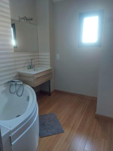 a bathroom with a white toilet and a sink at Maison de vacances à la montagne avec vue panoramique in Bolquere Pyrenees 2000
