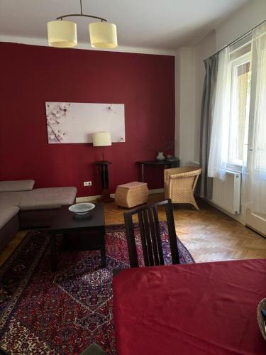 a living room with a couch and a table at Judy and Sandor Apartmen in Budapest