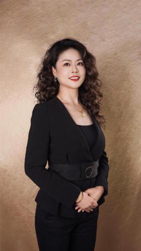 a woman is standing with her arms crossed at Kempinski Hotel Fuzhou in Fuzhou