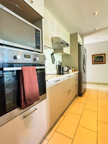 a kitchen with a large oven at Manta Cove by Horizon Holidays in Tamarin