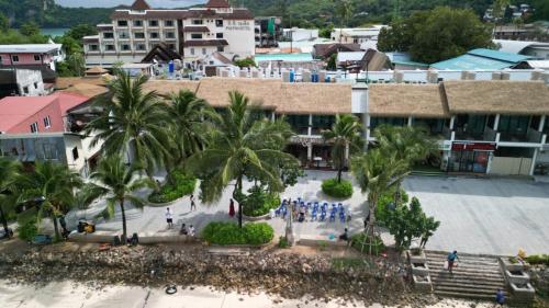a group of people standing in front of a building at Phi Phi at Pier in Phi Phi Don