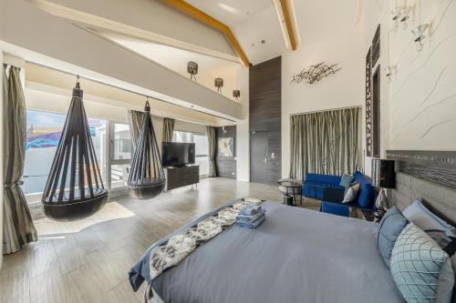a bedroom with a large bed and a living room at 白水木民宿 in Eluan