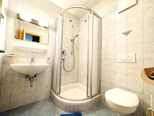 a bathroom with a shower and a toilet and a sink at Apartment in Fügen near Ski Lift in Fügen