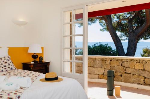 a bedroom with a bed and a window at Balamb Garden A Cinarchesa in Ajaccio