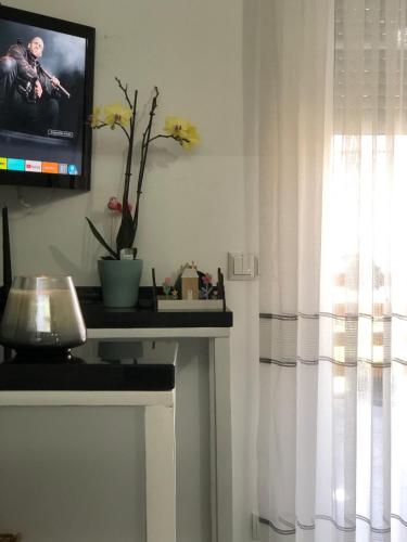 a living room with a tv and a fireplace at Beautiful 4-Bed House in the Weinviertel in Hollabrunn