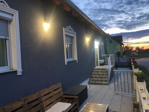 a house with a bench on the side of it at Beautiful 4-Bed House in the Weinviertel in Hollabrunn