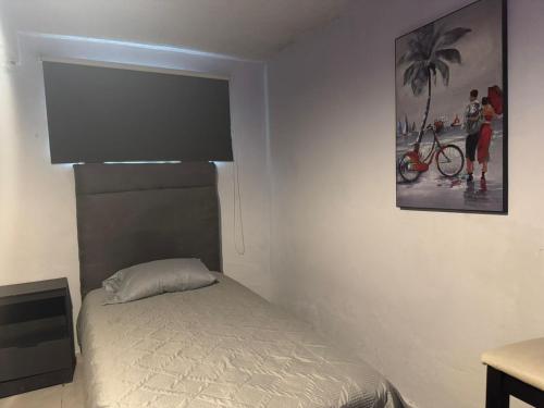 Una cama o camas en una habitación de El Hostalito Metepec