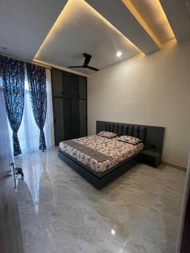 a bedroom with a bed and a ceiling at Aaroha Cove in Kālwāra
