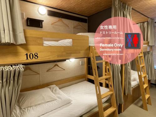 a couple of bunk beds in a room at COGO Ryogoku in Tokyo