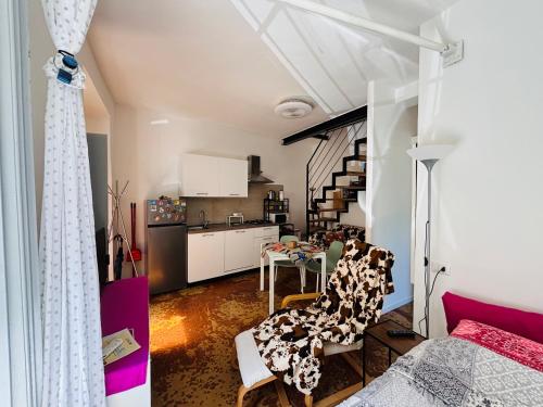 a room with a kitchen and a dining room at Friendly Africa Room Como Center in Como
