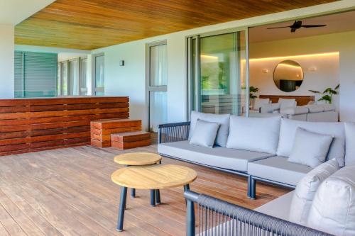 a living room with a couch and a table at Manta Cove by Horizon Holidays in Tamarin