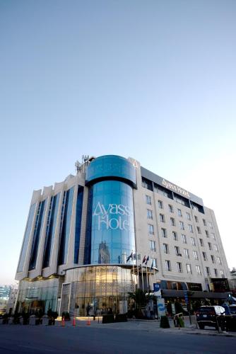 a building with a sign on the front of it at Ayass Hotel in Amman