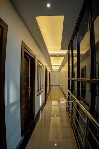a hallway of a building with a ceiling at Elite Residency in Vāniyambalam
