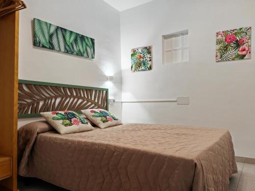 Postel nebo postele na pokoji v ubytování Hostal Noray