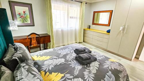 a bedroom with a bed and a couch in it at Amore in West Point