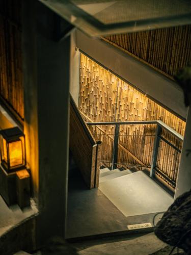 a view of a stairway in a building at Xueershanfang · Shanhaijing in Sanya