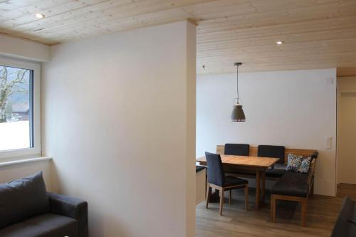a dining room with a table and chairs at Ferienwohnung Valisera in Sankt Gallenkirch