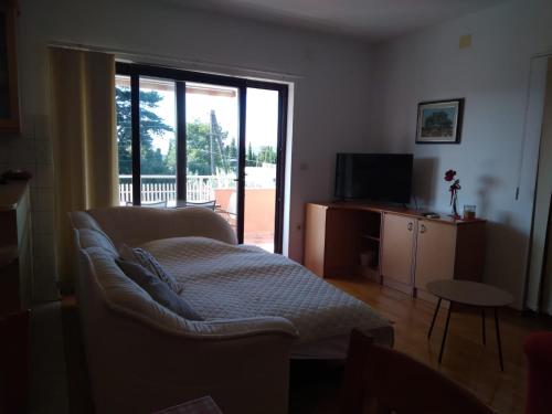 Ένα ή περισσότερα κρεβάτια σε δωμάτιο στο Apartman Maya