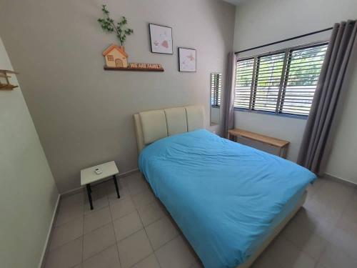 a small bedroom with a bed and a window at 75 pangkor ocean in Pangkor
