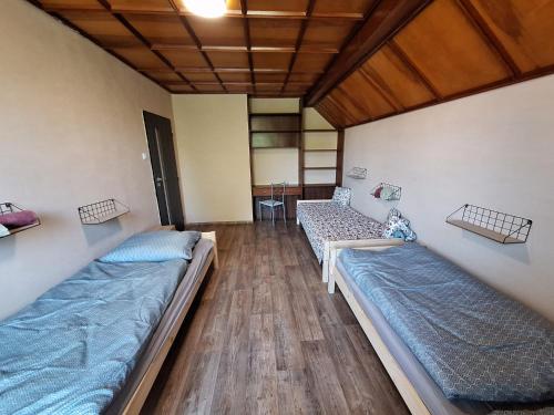 Postel nebo postele na pokoji v ubytování Apartmány ŠTĚSTÍ