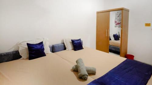 Postel nebo postele na pokoji v ubytování NamRoom at Tomang