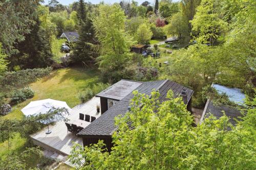 an aerial view of a house in the woods at Cosy Summerhouse With Private Garden in Nyrup