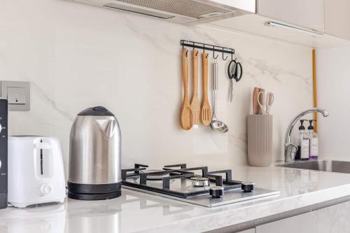 a kitchen counter top with a stove top oven at Studio Free Parking Pet Friendly Near Downtown Dubai in Dubai