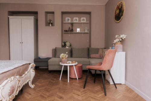 a living room with a couch and a table at Casa Joop Dolce far Niente in Magnano