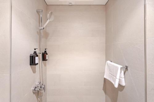a bathroom with a shower with a glass door at Studio Free Parking Pet Friendly Near Downtown Dubai in Dubai
