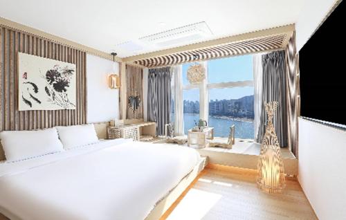 Postel nebo postele na pokoji v ubytování Hotel Badada
