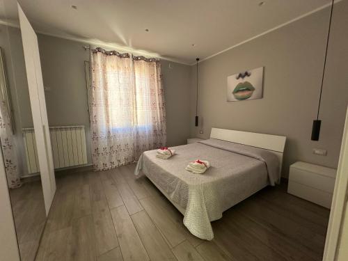 Giường trong phòng chung tại Mazzini Home