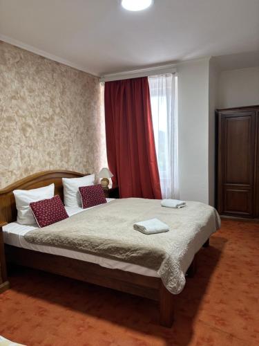 Postel nebo postele na pokoji v ubytování Hotel Bila Ruze