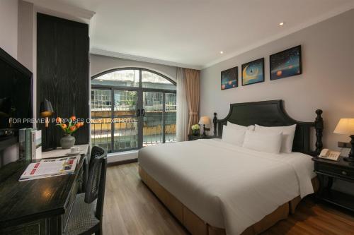 Postel nebo postele na pokoji v ubytování Paradise Grand Hotel