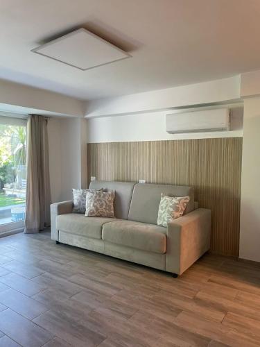 a living room with a couch and a window at A due passi dal mare in Montesilvano