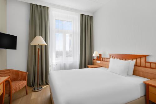 Danubius Hotel Rabaにあるベッド