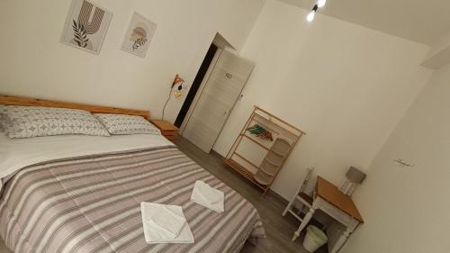 Postel nebo postele na pokoji v ubytování Tati's Garden