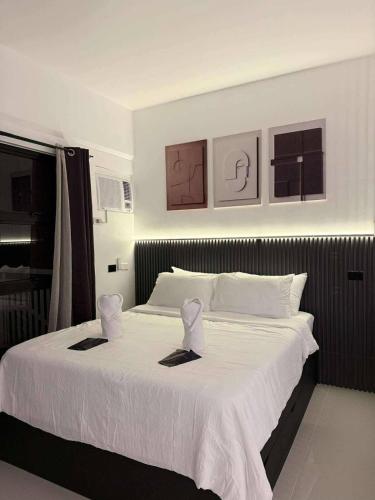 Ένα ή περισσότερα κρεβάτια σε δωμάτιο στο Luxury Seaview Apartment Panglao